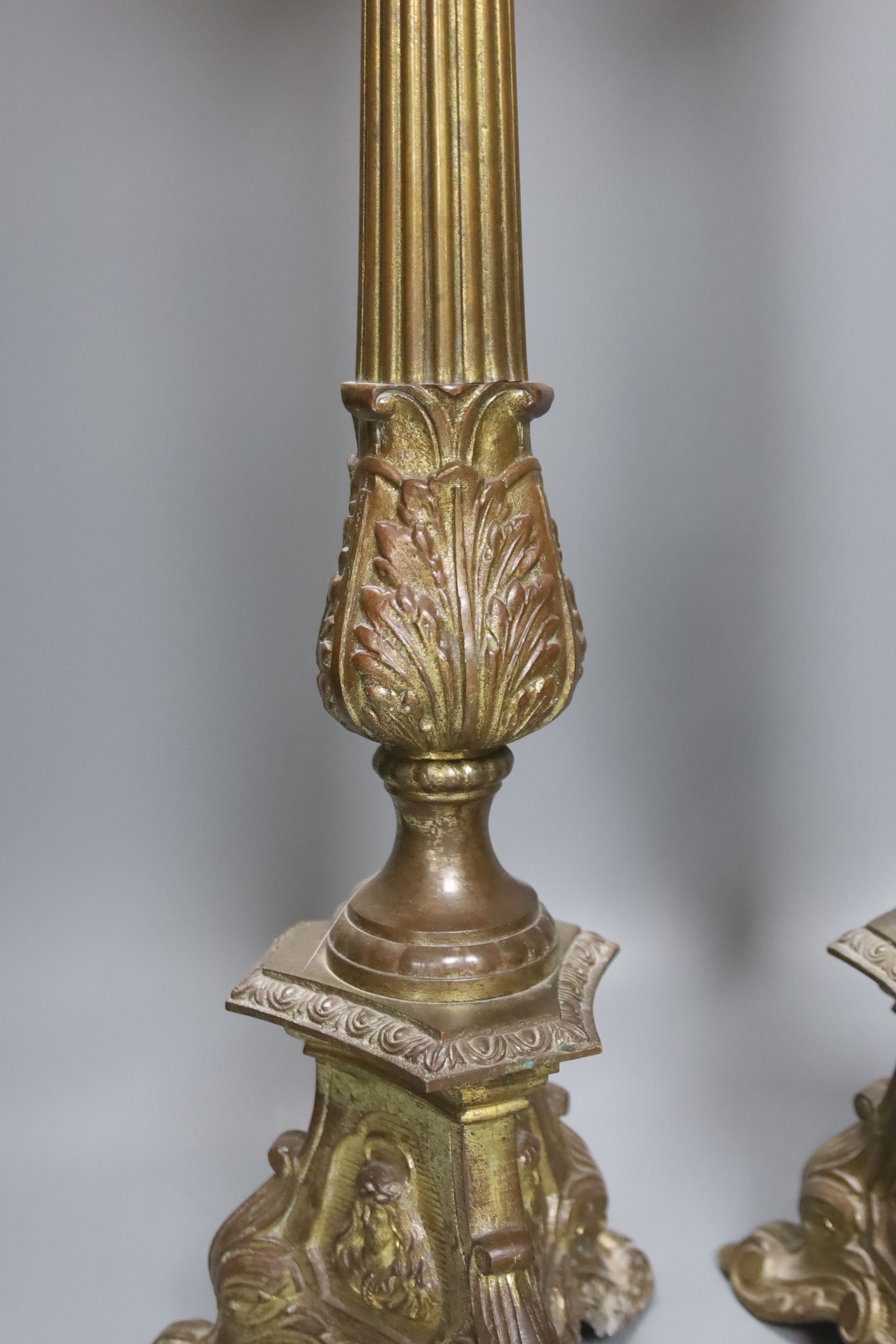 A pair of gilded brass pricket candlesticks 61cm